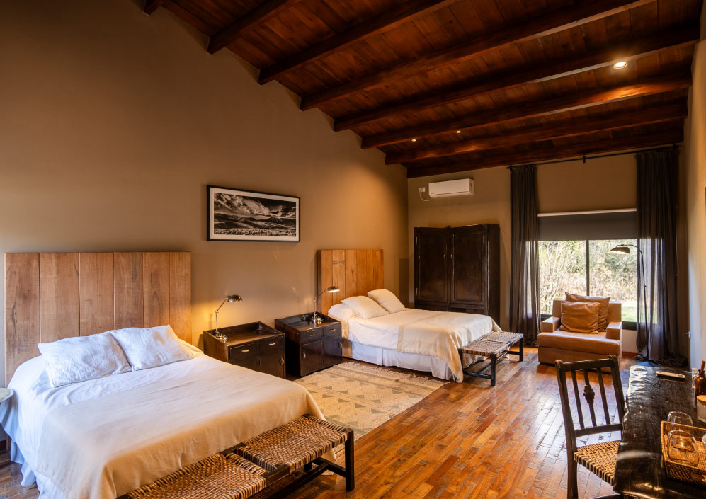 Spacious bedroom with private bathroom at Escondido Lodge
