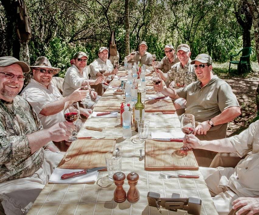 Hunters toasting after a successful dove hunt, Córdoba Argentina